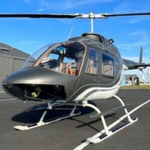 1975 BELL 206 JET RANGER helicopter for sale on AvPay by Omnijet. Parked outside the hangar