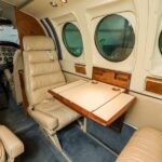 1979 Beechcraft King Air C90 turboprop airplane for sale on AvPay by Jetron. Tray table
