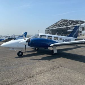 1979 Blue and White Piper PA-34-200T Seneca II for sale by Eurplane Sales. View from the left-min