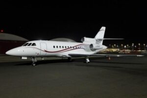 1988 Dassault Falcon 900B Private Jet For Sale (N988T) From Omnijet On AvPay aircraft exterior front left at night