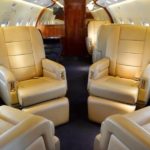 1998 Bombardier Challenger 604 for sale by Southern Cross Aviation. Club 4 facing each other-min