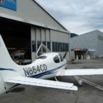 2002 Cirrus SR20 for sale by Aeromeccanica. Right fuselage in front of hangar