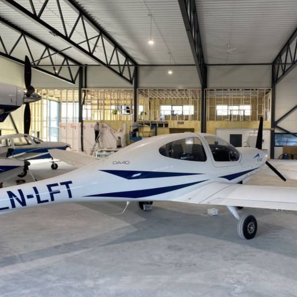 2003 Diamond DA40 Star TDI For Sale in Norway by GT Aviation. Aircraft in the hangar-min