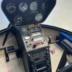 2004 Robinson R44 Raven II (N93FE) Piston Helicopter For Sale From Pacific AirHub on AvPay aircraft interior console and instruments