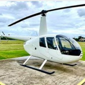 2008 Robinson R44 II Piston Helicopter For Sale stationary on helipad-min