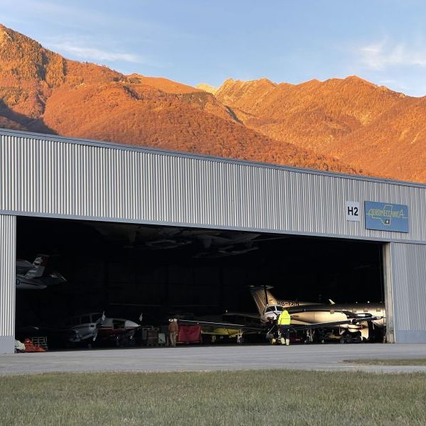 Aeromeccanica On AvPay mountains behind hangar