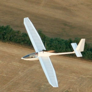 Aeros AC21 Glider in flight over farm fields from above