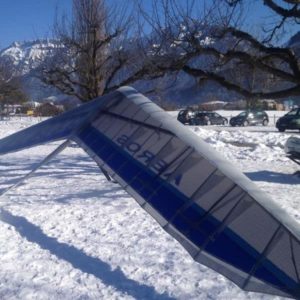 Aeros Combat C Hang Glider on ground in the snow