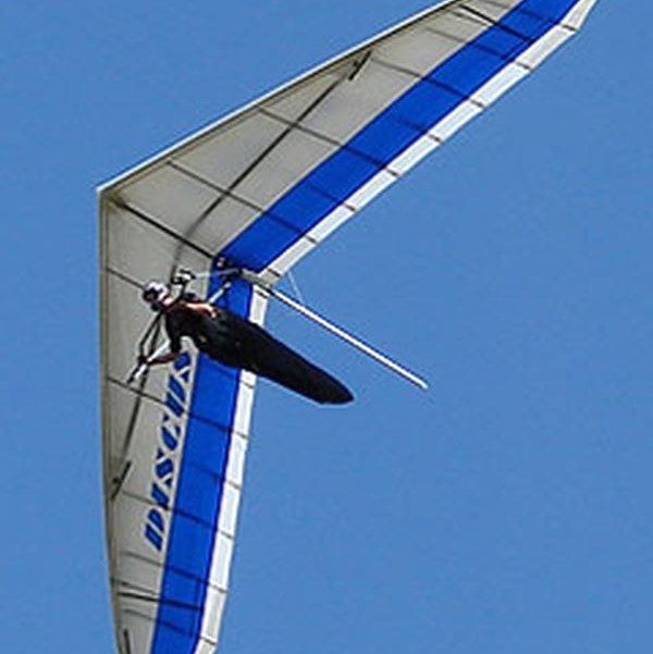 Aeros Discus Hang Glider flying in sky looking up
