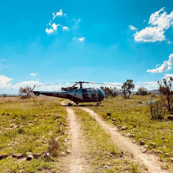 Alouette Helicopter parked in the African Bush-min