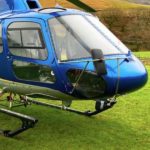 Blue 2006 Eurocopter AS350B3+ for sale by Savback Helicopters. Parked in a field-min