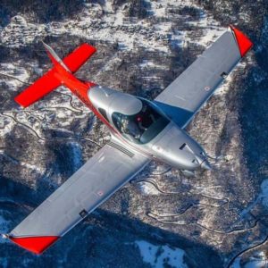 Bristell B23 Turbo flying over snowy fields view from above