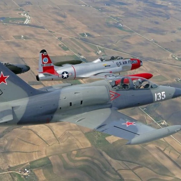 Code 1 Aviation jet fighters in air over countrysides