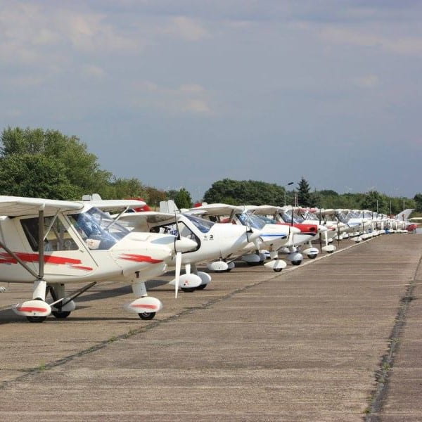 Comco Ikarus planes lined up down runway