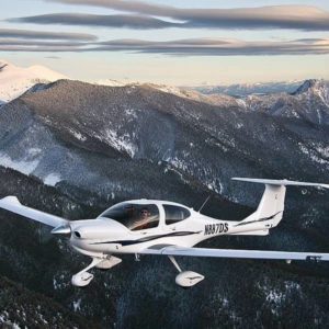 DA40 XLT flying over mountains