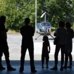 Discovery Flights From STB Copter family waiting for helicopter