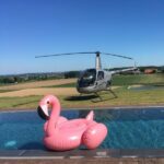 Discovery Flights From STB Copter landed beside a swimming pool