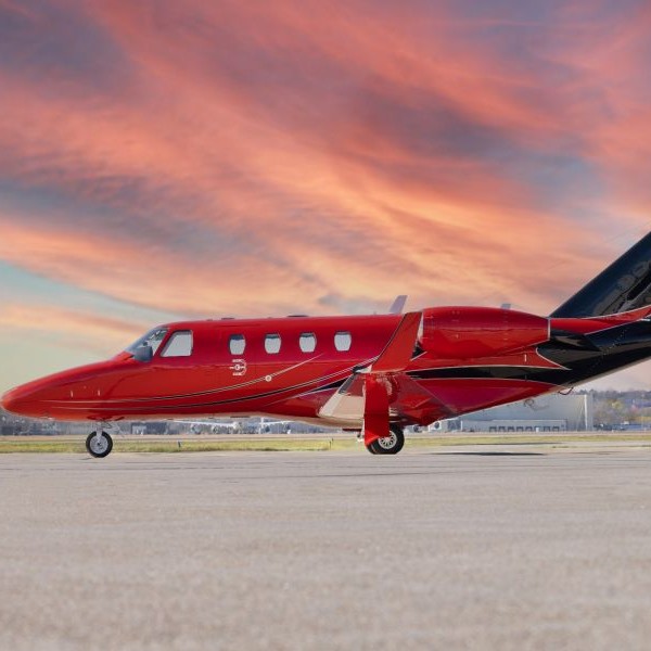 Duncan Aviation Aircraft Sales on AvPay left side of red jet aircraft