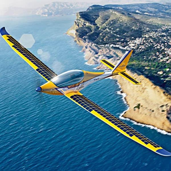 Elektra Solar plane in flight over coast