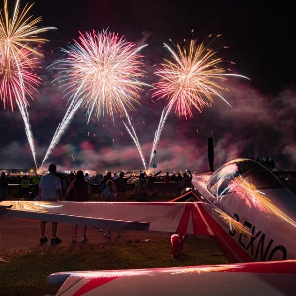 Extra plane with a backdrop of fireworks