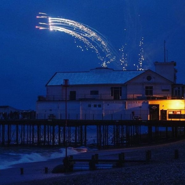 Fireworks display by pier