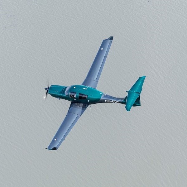 Gemstone Aviation DA50 RG flying over water