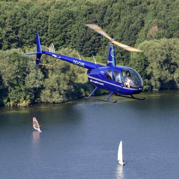 Gift Vouchers From STB Copter helicopter flying over lake