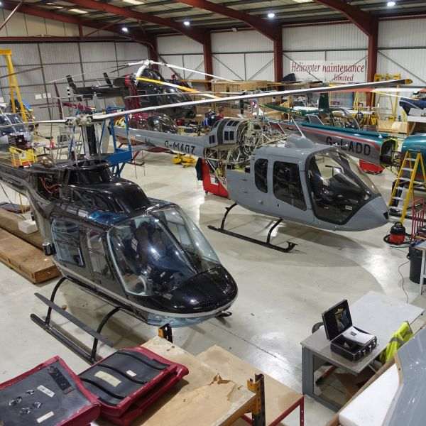 Heliflight UK Ltd On AvPay hangar full of helicopters