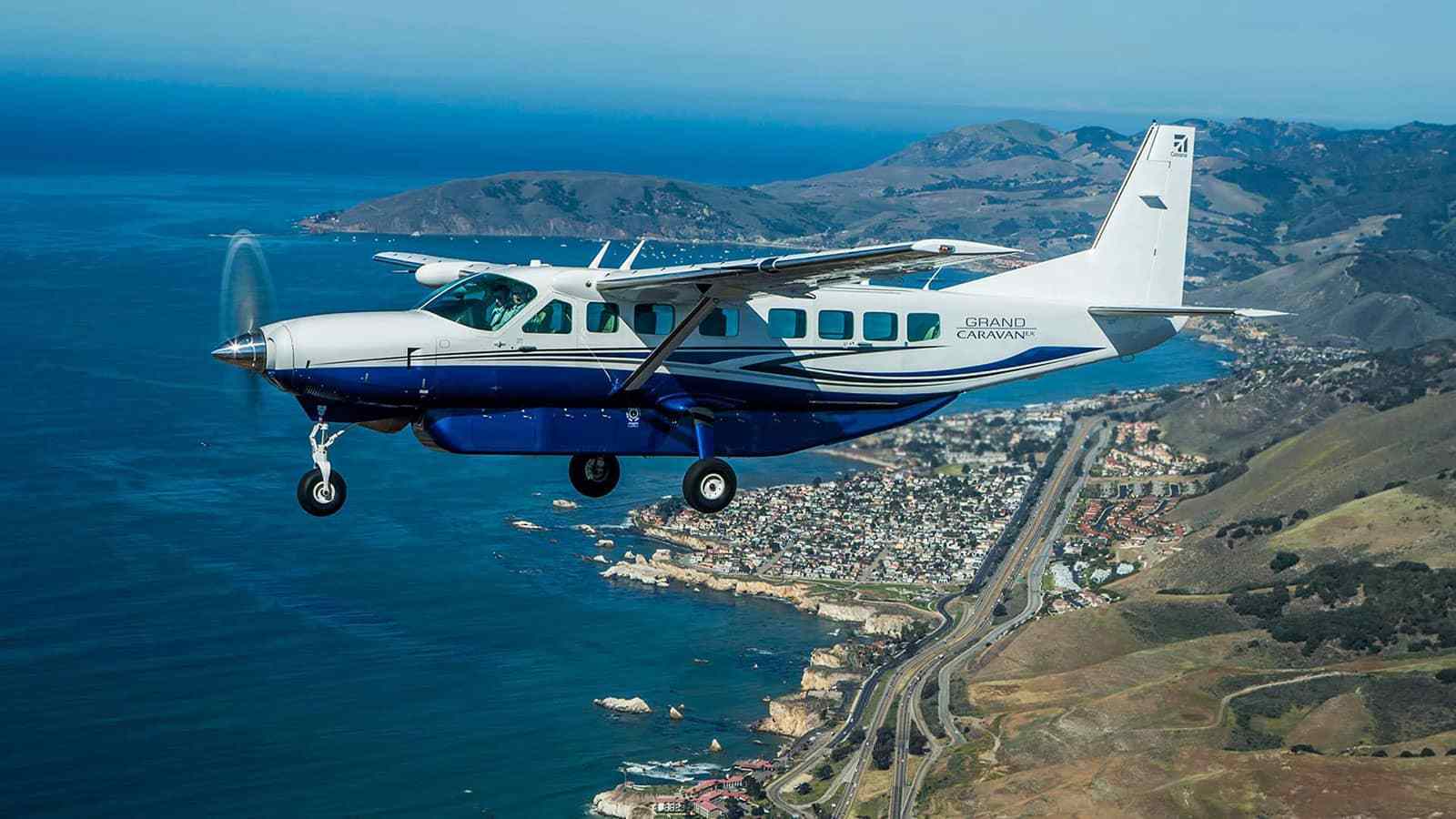 ISR Conversion for Cessna 208B Grand Caravan EX. Airborne, flying over the beach
