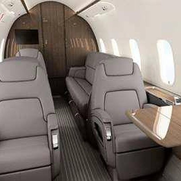 Indigo Lyon on AvPay private jet interior seats and table