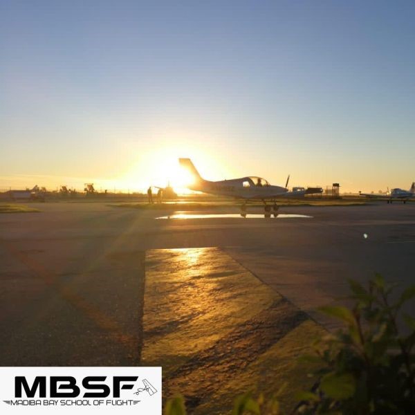 Madiba Bay School of Flight Gallery Sling Aircraft parked at the airport with sunset in the backgroun