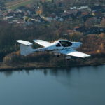 New ATEC 321 Faeta Microlight Airplane For Sale in flight over water