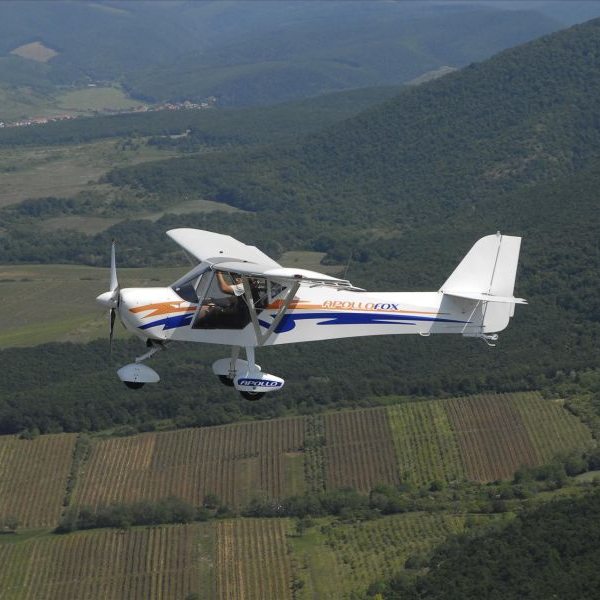 New Apollo Fox Ultralight Aircraft For Sale From Exodus Aircraft in flight over countryside