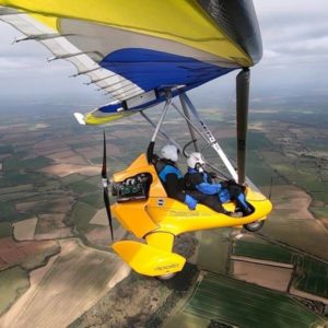 New Exodus Aircraft DeltaJet 500 StingRay Microlight Aircraft For Sale by Cumbria Aviation in flight over countryside