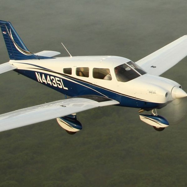 New Piper Archer DLX Single Engine Piston Aircraft For Sale in flight over trees