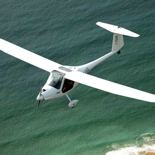 New Pipistrel Sinus 912 Motorised Glider For Sale in flight over beach