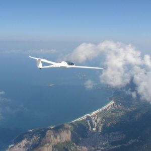 New Pipistrel Taurus M Motorised Glider For Sale flying over coast line