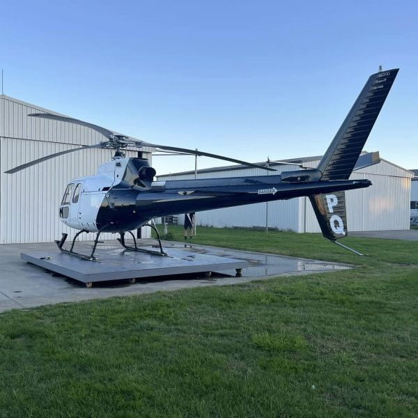 Pacific Aircraft Services. Eurocopter AS350 parked in front of the hangar