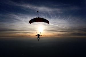 Parachute gliding with sunset in the background