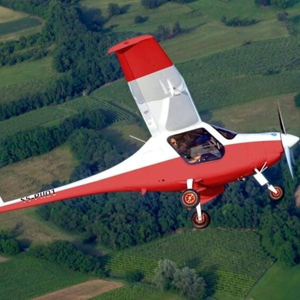 Pipistrel Aircraft banking left over fields-