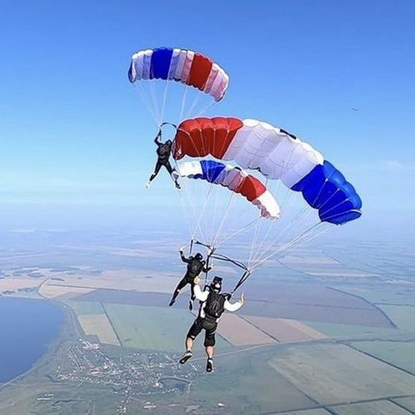 SAAM parachuting over clear fields
