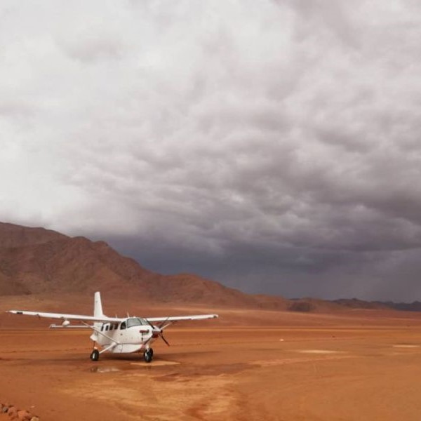 Scenic Air Namibia two planes landed plane with storm coming