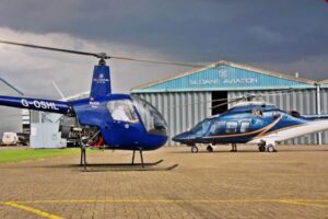 Sloane Helicopters Hangar with Robinson R22 and Agusta AW 109 S Grand-min