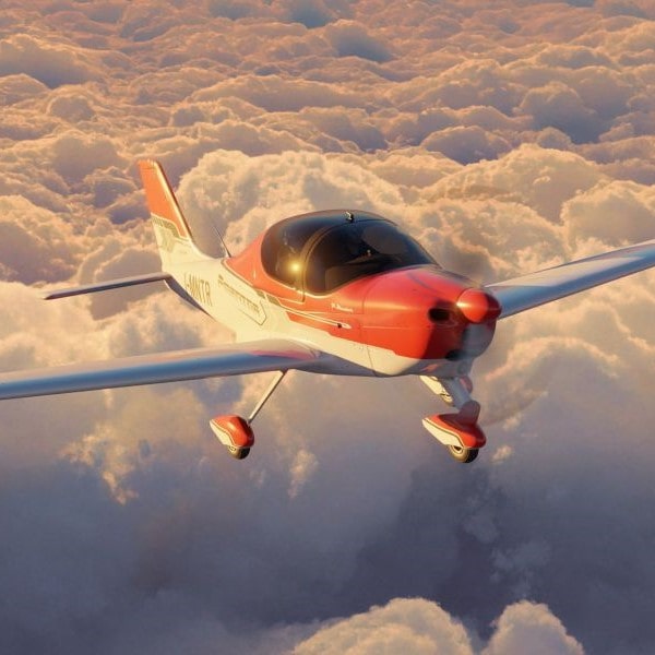 Tecnam Aircraft flying above the clouds