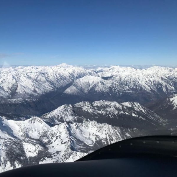 Tecnam Aircraft view of snow capped mountains