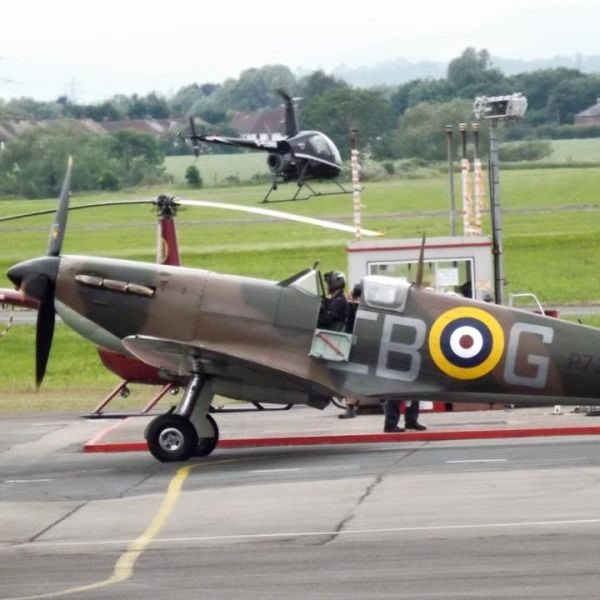 The Aviator Airfield Cafe at Gloucester Airport Supermarine Spitfire parked in front of cafe
