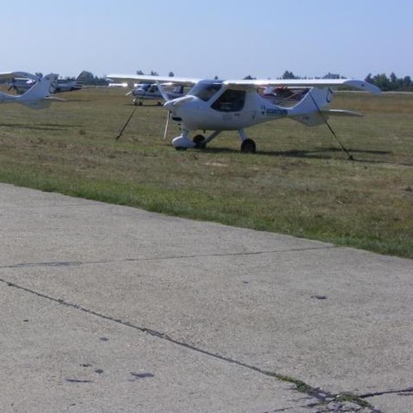 Tököl Airport Aircraft parked on the grass-min
