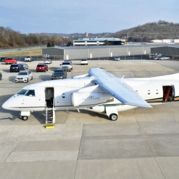 Ultimate Jetcharters. Dornier 328 parked on the ramp-min