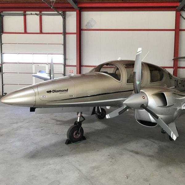 Vienna Jets on AvPay. Diamond DA42 parked in the hangar