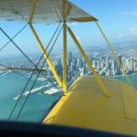 Waco Air Museum aircraft flying past Chicago-min